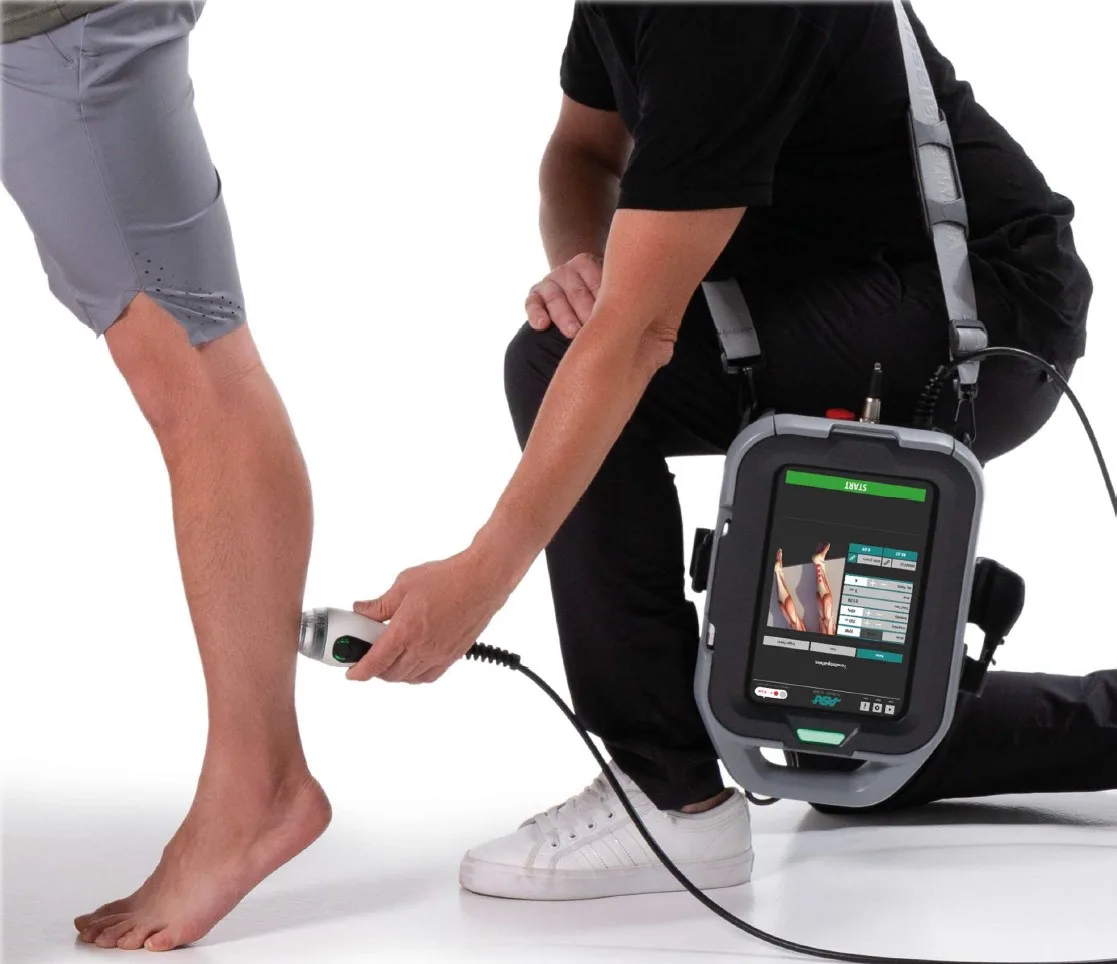 Portable MLS laser treating a patient's foot