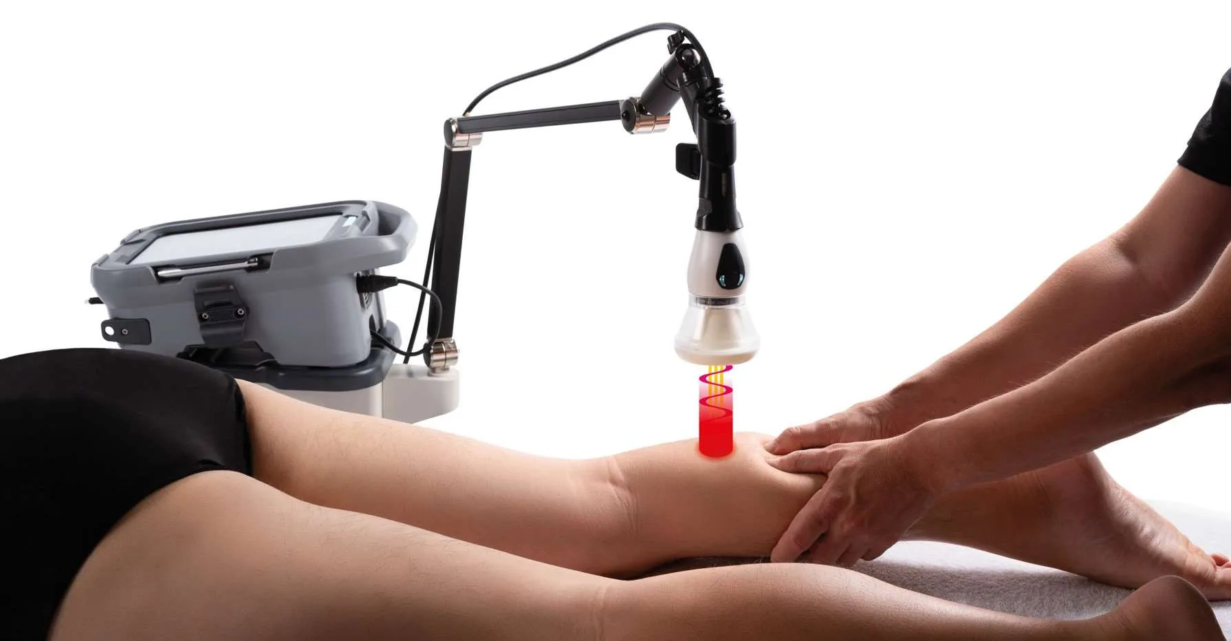 Clinician delivering MLS laser therapy to a patient's leg